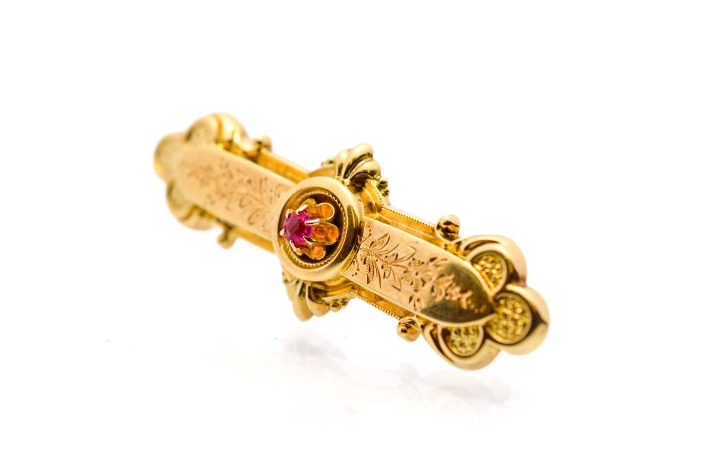 Starožitná zlatá brož s rubínem